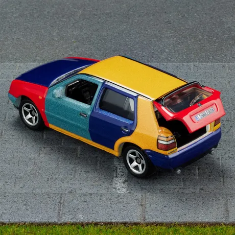 Matchbox Collectors 1995 Volkswagen Golf Harlequin, high rear view with hatch open