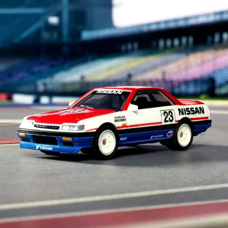 Matchbox Collectors 1987 Nissan Skyline GTS-R diecast on a race-track diorama